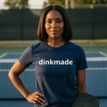 The Wordmark Tee — Cream on Navy (Heavyweight) — worn on the court