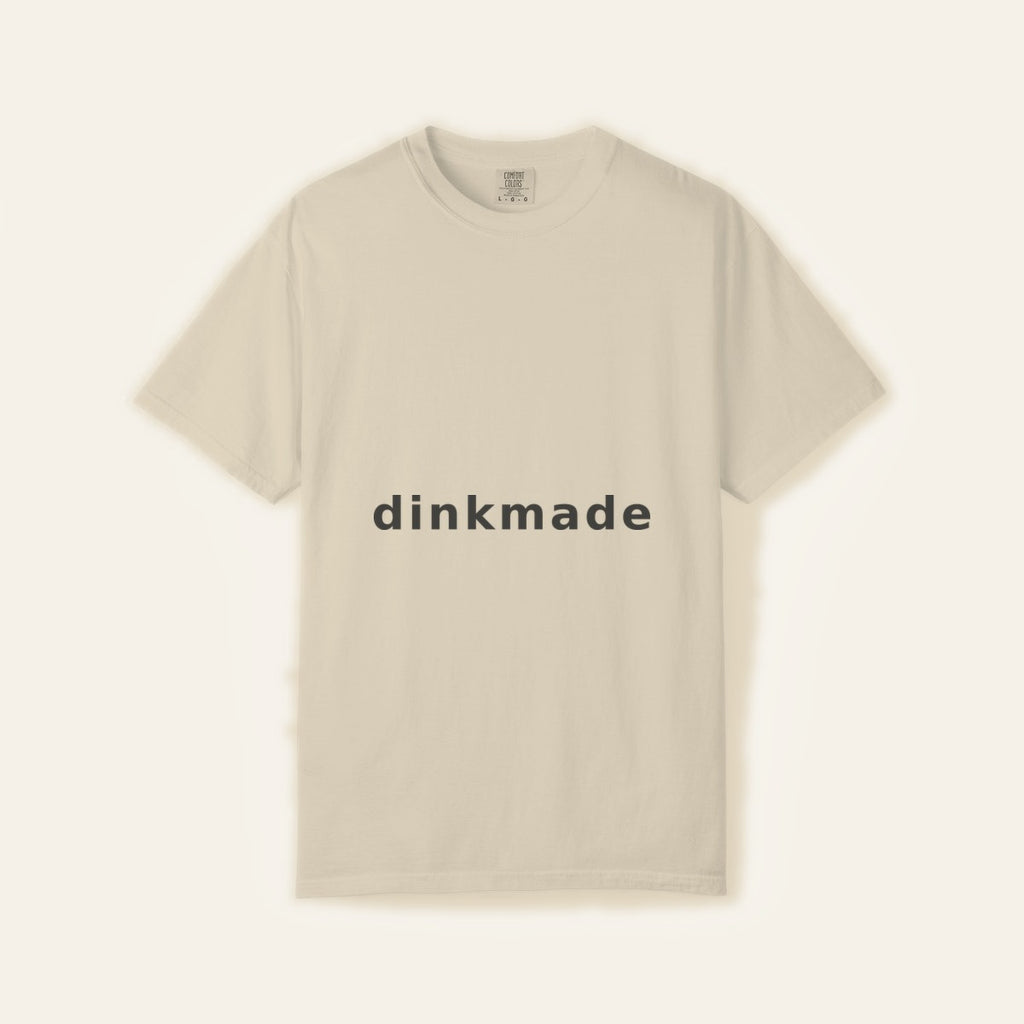 The Wordmark Tee — Charcoal on Sand — product flat lay